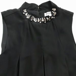 Black babydoll dress with beaded neckline